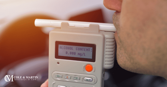 blowing into a breathalyzer blood alcohol content dwi driving under the influence dui