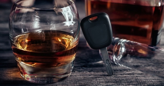 alcohol drink and car keys on a table