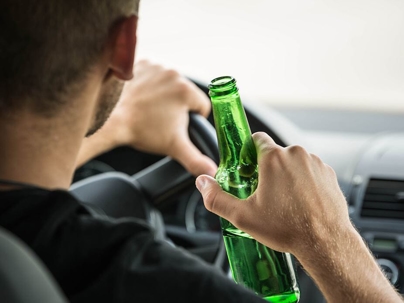 driver with a bottle of alcohol