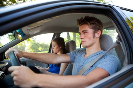 Smart Male Teen Driver Paying Attention To Road